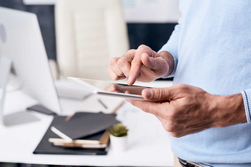 man with phone in his hands checking social media